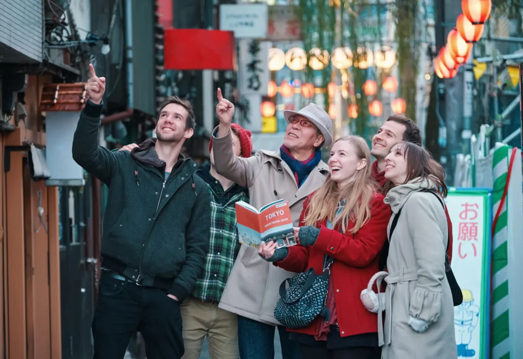 Travelers enjoying a guided local experience in a traditional Japanese street