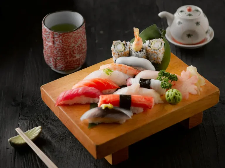 Authentic Japanese sushi platter with green tea and traditional table setting
